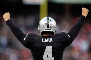 OAKLAND, CA - DECEMBER 07: Derek Carr #4 of the Oakland Raiders celebrates in the fourth quarter against the San Francisco 49ers at O.co Coliseum on December 7, 2014 in Oakland, California. (Photo by Brian Bahr/Getty Images)